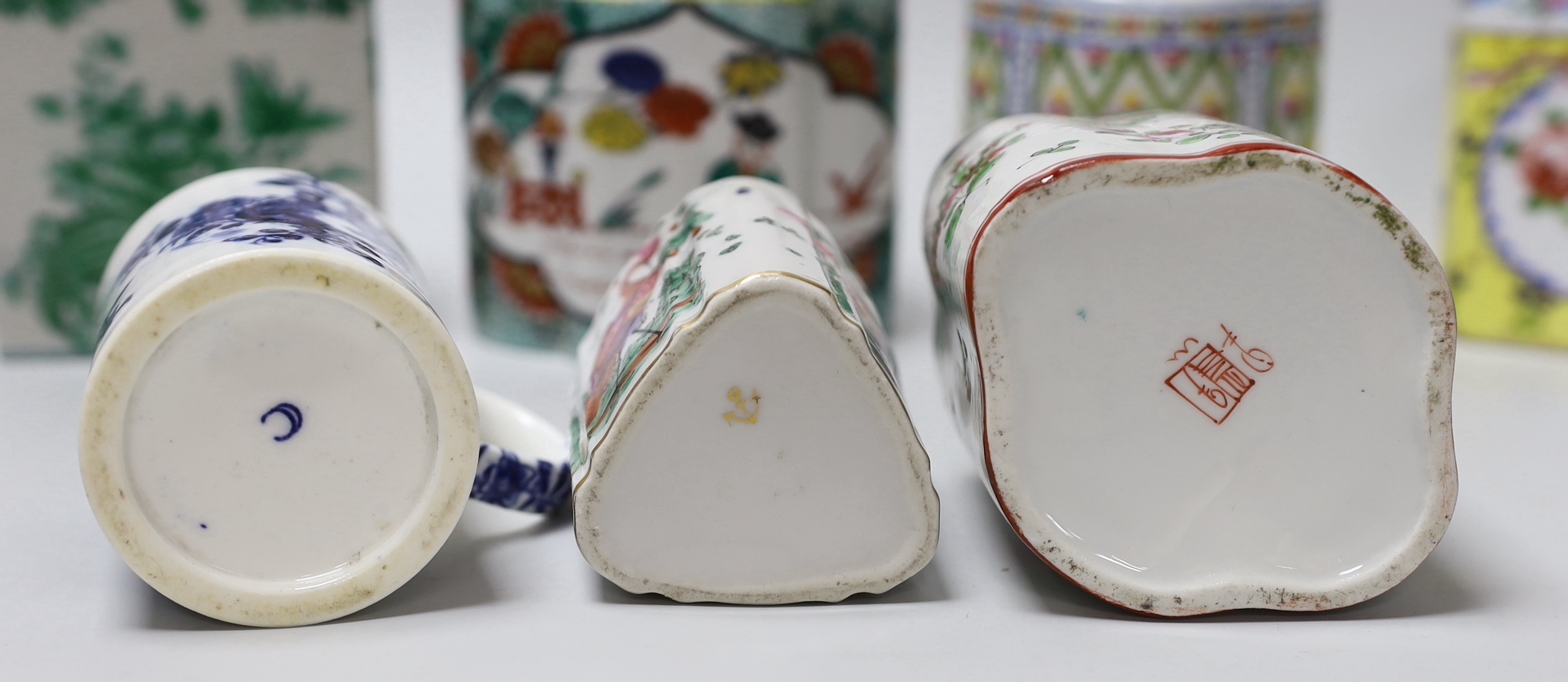 A group of seven floral Continental tea canisters (one with cover) and a Worcester style bone china mug, the largest 15.5cm high